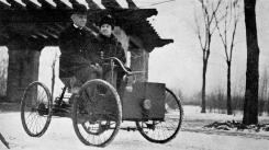 MAN OF EXTREMES Henry Ford and his wife in his first car.